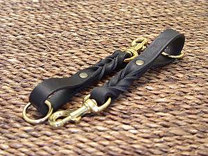 Short leather dog leash (pull tab leash) for dog training or for dog owners